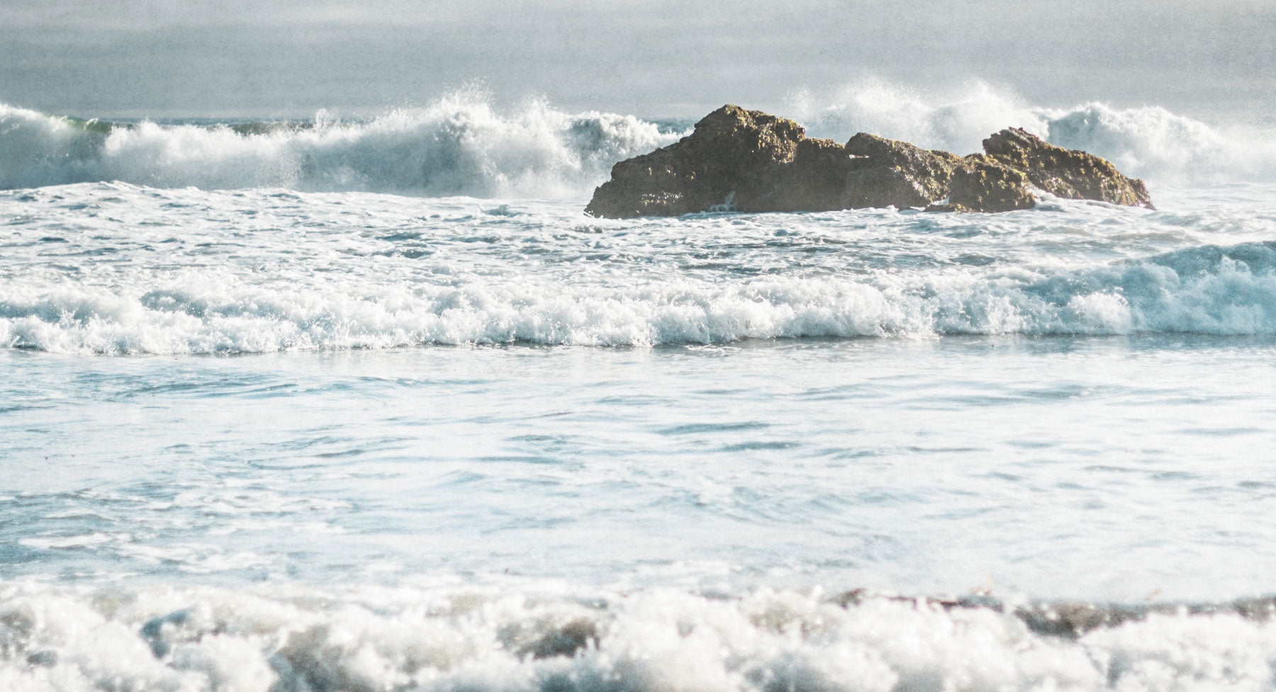 Coastal Wall Art print of waves crashing over rocks