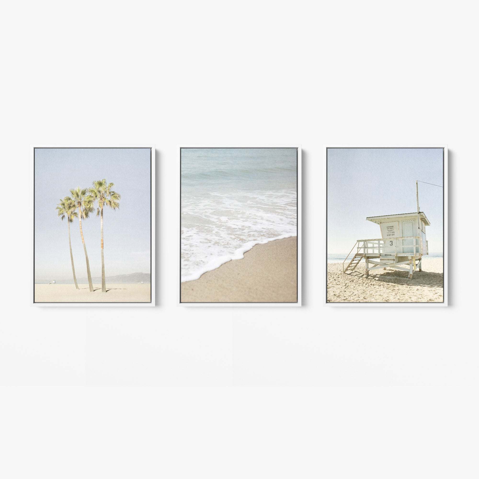 Offley Green's Set of 3 Framed Canvas offers multiple print choices: one with palm trees on a beach, another featuring ocean waves, and a third depicting a lifeguard tower. Crafted from FSC-certified renewable forests, each piece features coastal styles in soft, muted colors.