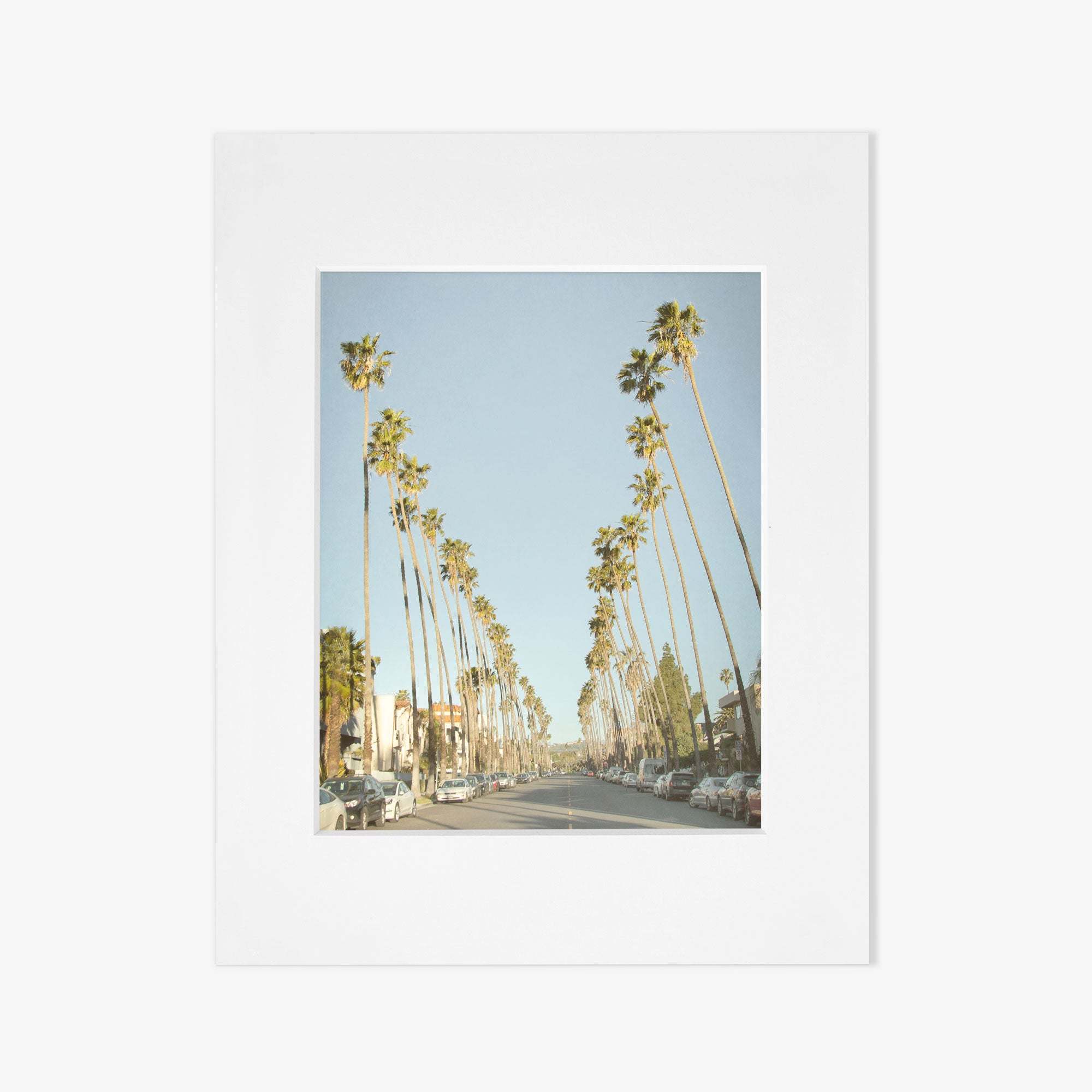 A simplistic white square frame with a clean design, showcasing an empty gray central area suitable for displaying artwork or a photograph of Los Angeles Palm Tree Lined Street 'Sunset Boulevard Dreams' by Offley Green.