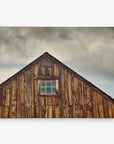 The Offley Green 8x10 Rustic Canvas Print, featuring a wooden barn under a cloudy sky, captures the weathered brown tones of wood for an authentic texture, reminiscent of charming rustic art. Choose from 10+ designs to bring this canvas gallery wrap into your space.