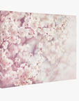 The Offley Green 24X30 Botanical Canvas Print features delicate cherry blossoms in full bloom against a light backdrop. The soft pink and white flowers create a dreamy, serene atmosphere, ideal for fans of botanical prints. Choose from 10+ designs for springtime tranquility.
