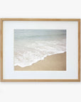 Framed photograph of a serene California beach scene showing Beach Waves Print, 'Chasing Surf' printed on archival photographic paper and encased in a light wooden frame against a white background. Brand: Offley Green.