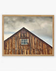 A framed Farmhouse Rustic Print of 'Old Barn at Bodie' by Offley Green, showcasing rustic textures and a single centered window, printed on archival photographic paper.