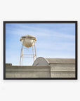 Framed photograph of a classic white water tower labeled "Los Angeles Sony Pictures Studio Print, 'Sony Lot'" atop an industrial building against a clear blue sky by Offley Green.