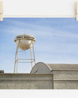 A photo of a water tower labeled "Sony Studios" against a clear sky, seemingly displayed as an unframed print hanging by clips on a wire. This is the Los Angeles Sony Pictures Studio Print by Offley Green, also known as the 'Sony Lot' print.