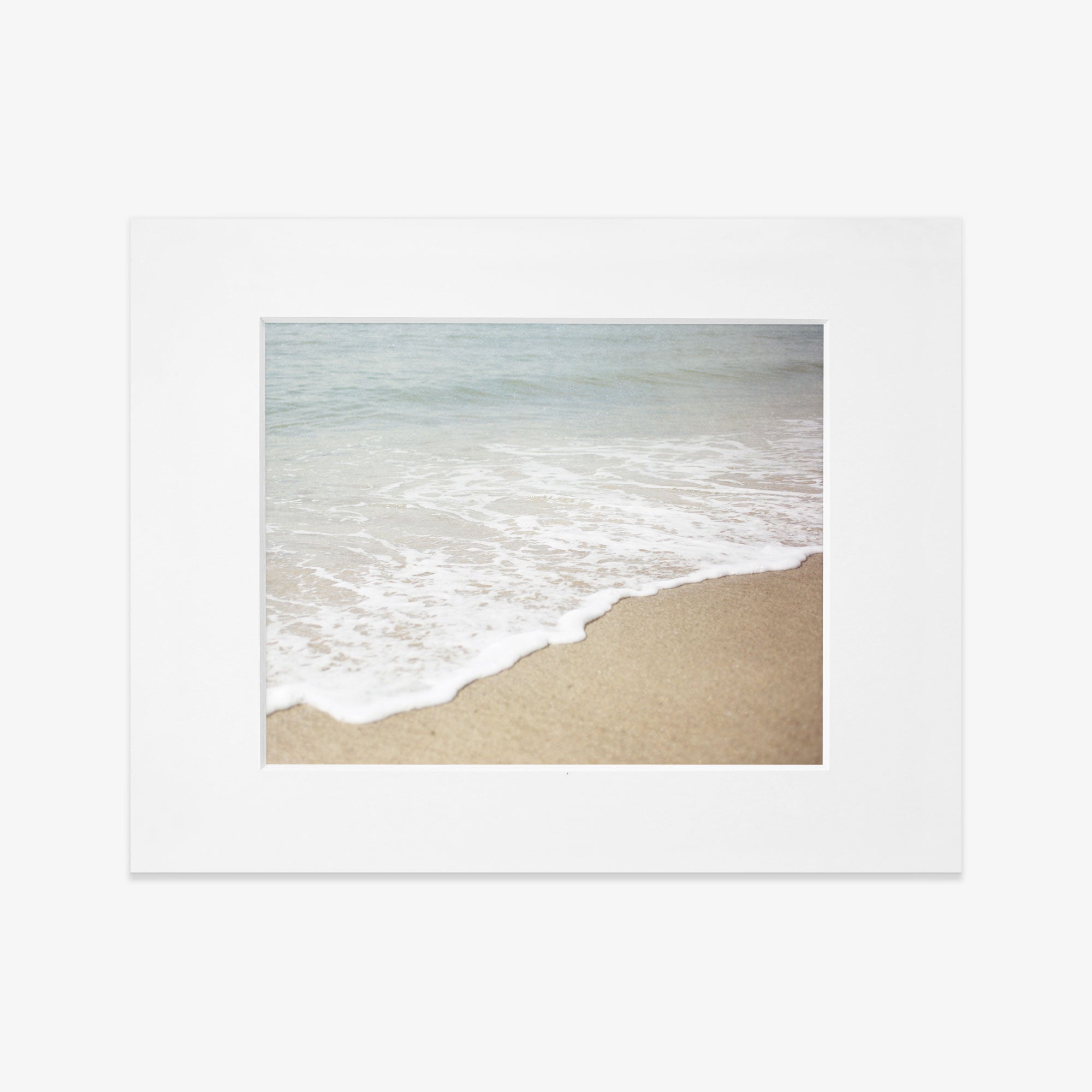A Beach Waves Print, &#39;Chasing Surf&#39; by Offley Green capturing the serene interaction between the ocean and the shore with a polaroid photo.