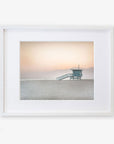 A framed photograph of a Pink Coastal Print, 'Lifeguard Tower' by Offley Green, on archival photographic paper.
