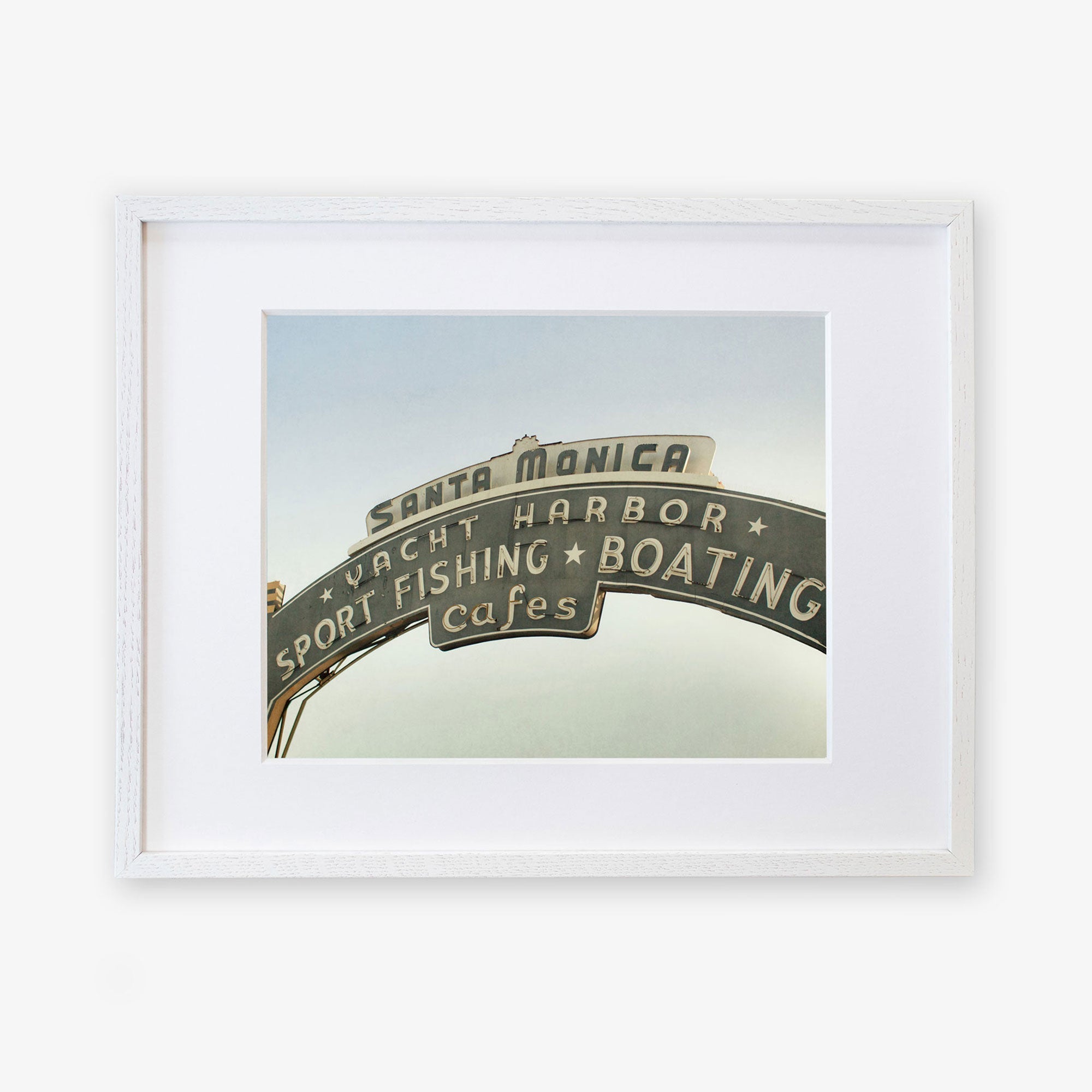 A framed archival photographic print of the Los Angeles California Print, &#39;Santa Monica Pier Blues&#39; by Offley Green, featuring text and symbols related to sport fishing, boating, and cafes on a clear day.