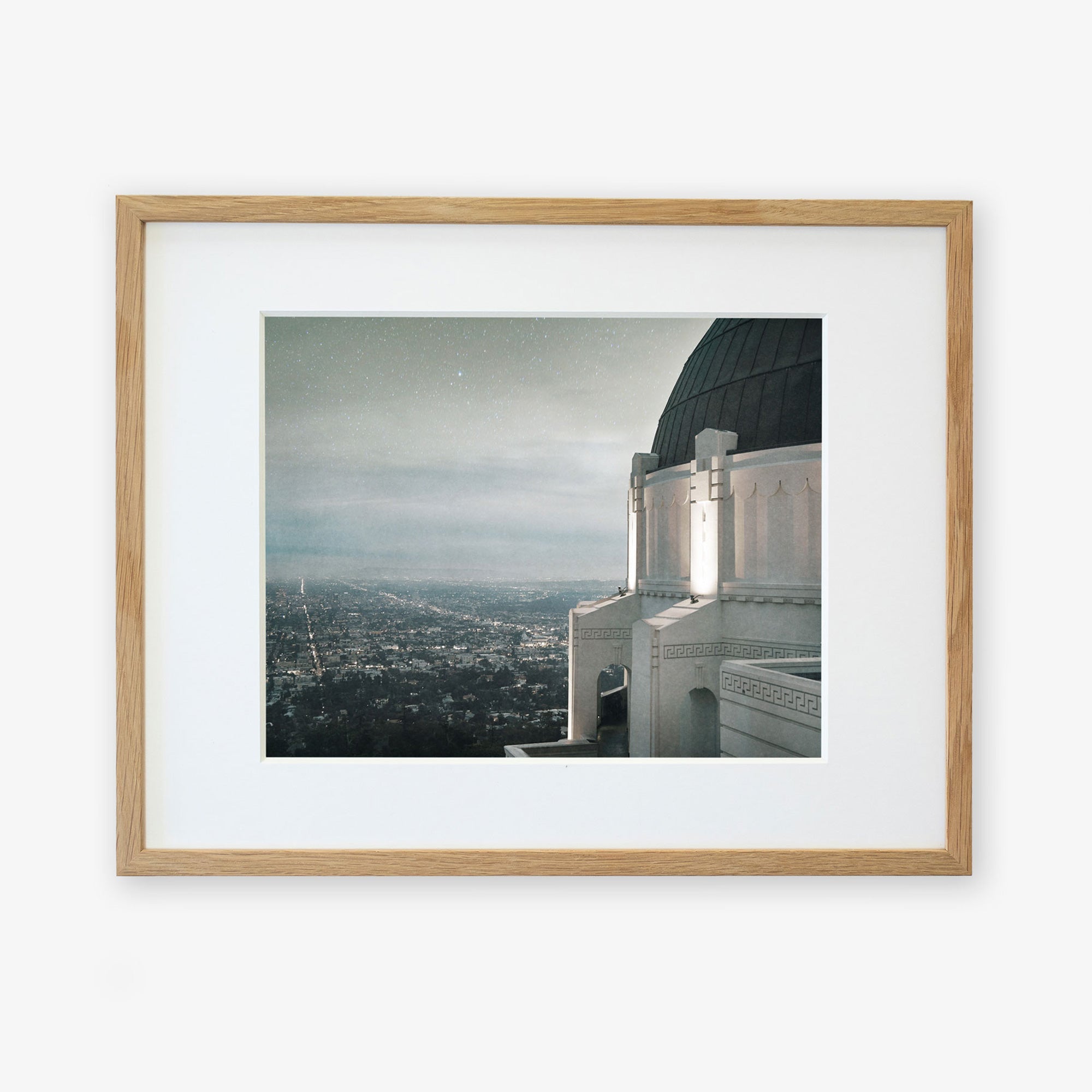 Framed archival photographic Griffith Observatory Print, 'The Sky At Night' of a Los Angeles city view at dusk viewed from a high vantage point next to the Griffith Observatory, showcasing a twinkling skyline under a soft, dark sky by Offley Green.