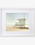 A framed photograph of "California Summer Beach Art, 'Malibu Lifeguard Tower'" by Offley Green, numbered "3" with stairs leading up to the enclosed platform.