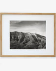 Black and white photograph of the Hollywood sign on a hill, printed on archival photographic paper, framed in a light wooden frame, against a plain white background.
Product Name: Offley Green Hollywood Sign Black and White Vintage Print, 'Old Hollywood'