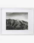 Black and white photo of the Hollywood Sign Black and White Vintage Print by Offley Green, displayed in a white frame against a white background.