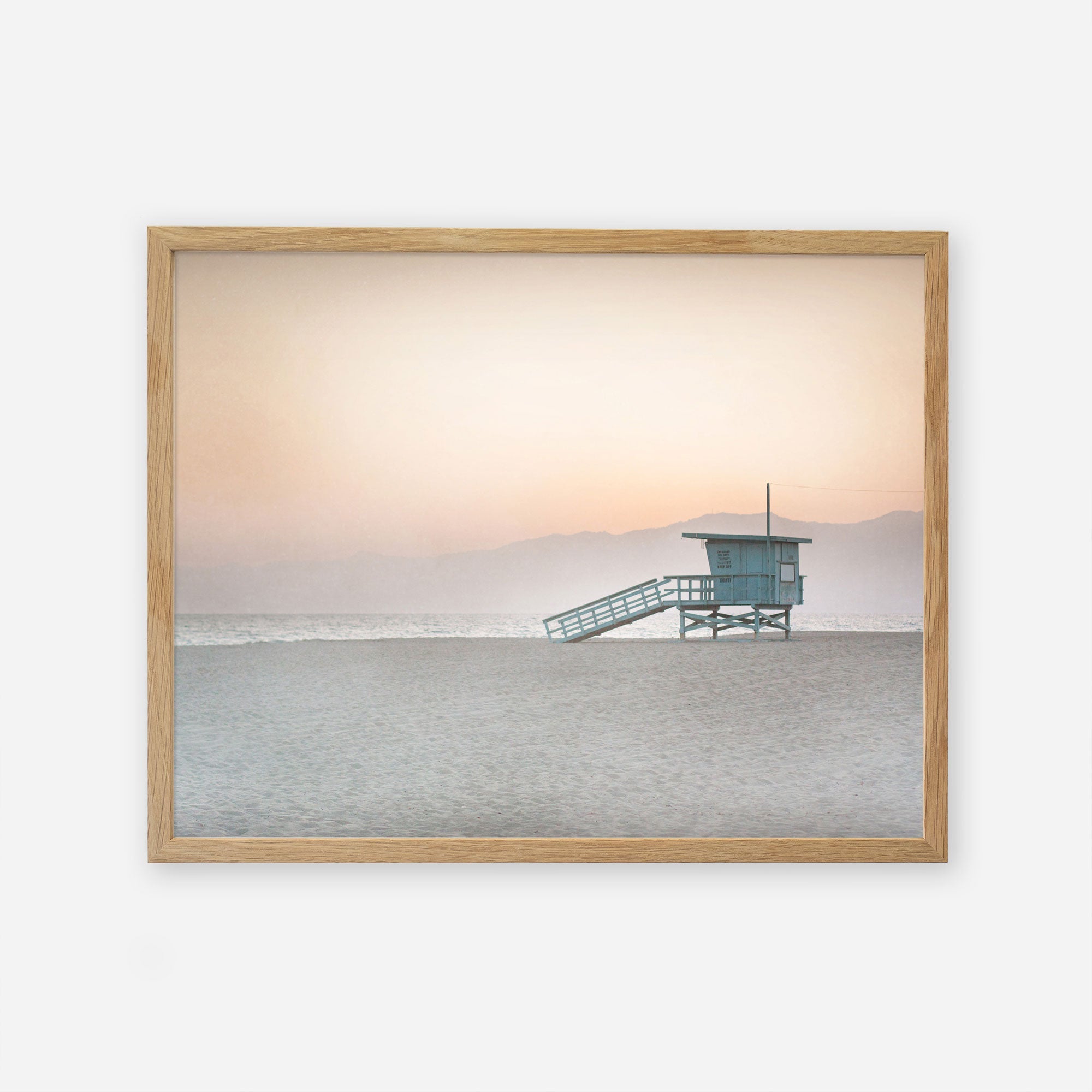 A framed photograph of a Pink Coastal Print, &#39;Lifeguard Tower&#39; by Offley Green on archival photographic paper.