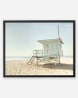 A framed photograph of the California Summer Beach Art, 'Malibu Lifeguard Tower' by Offley Green, situated on a sandy beach in Malibu under a clear sky, with its facade numbered "3".
