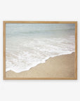 A framed photograph of Offley Green's 'Chasing Surf' Beach Waves Print, capturing the gentle waves meeting the sandy shore in a serene California beach scene, displayed on a plain white background.
