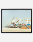 A framed Offley Green California Print, 'Santa Monica Pier' on archival photographic paper depicting Santa Monica Pier with a ferris wheel and roller coaster, set against a clear sky.