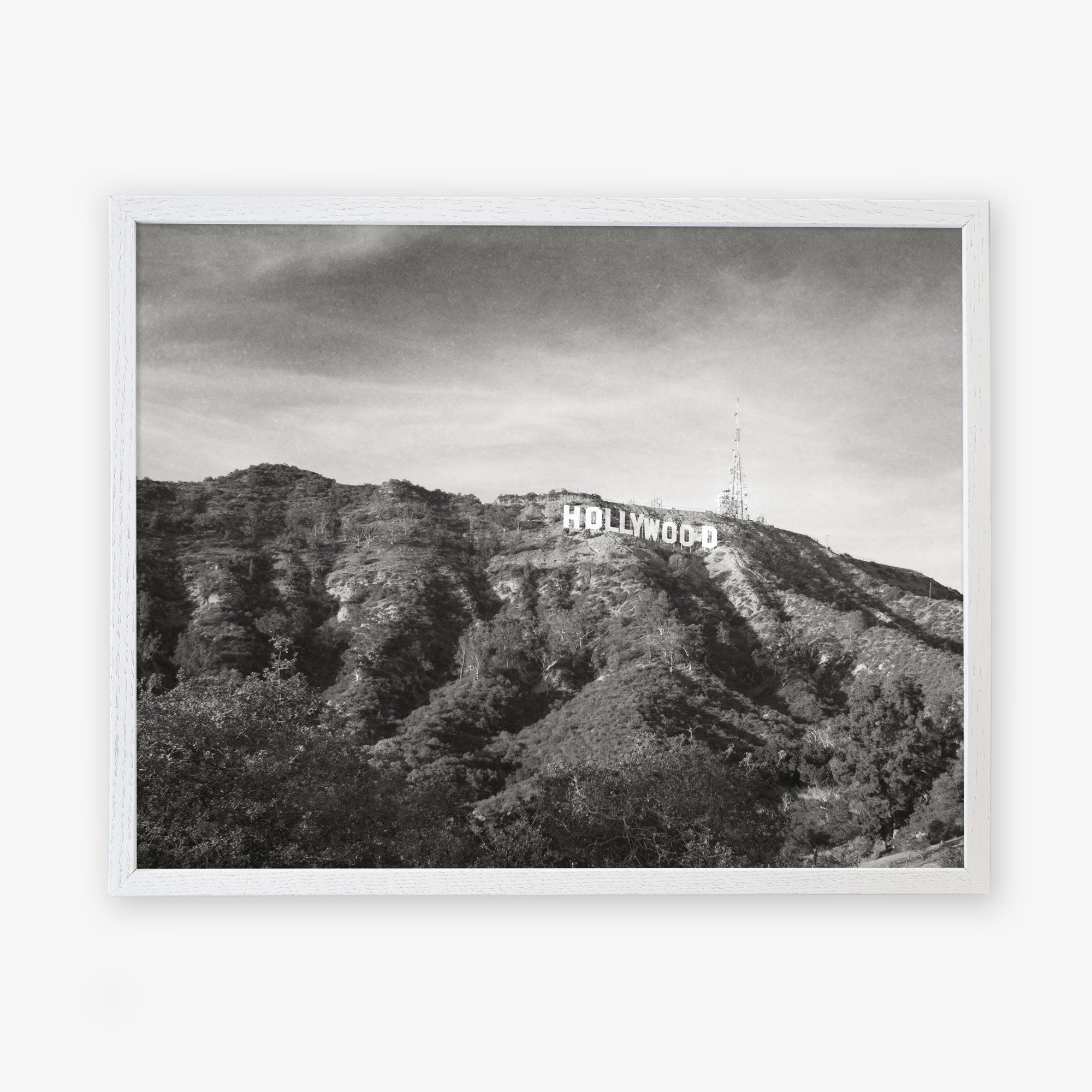 Black and white photo of the Hollywood Sign Black and White Vintage Print, &#39;Old Hollywood&#39; on a hillside, printed on archival photographic paper, framed by a clear sky and sparse vegetation, by Offley Green.