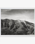 Black and white photo of the Hollywood Sign Black and White Vintage Print, 'Old Hollywood' on a hillside, printed on archival photographic paper, framed by a clear sky and sparse vegetation, by Offley Green.