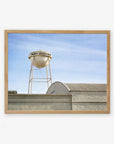 A framed photograph of an old water tower labeled "Los Angeles Sony Pictures Studio Print, 'Sony Lot'," above an industrial building against a clear blue sky by Offley Green.