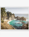 A framed aerial photograph of the Big Sur Coastal Print, 'Julia Pffeifer' by Offley Green, on archival photographic paper, depicting a scenic coastal view with turquoise waters, rugged cliffs, and lush greenery under a hazy sky.