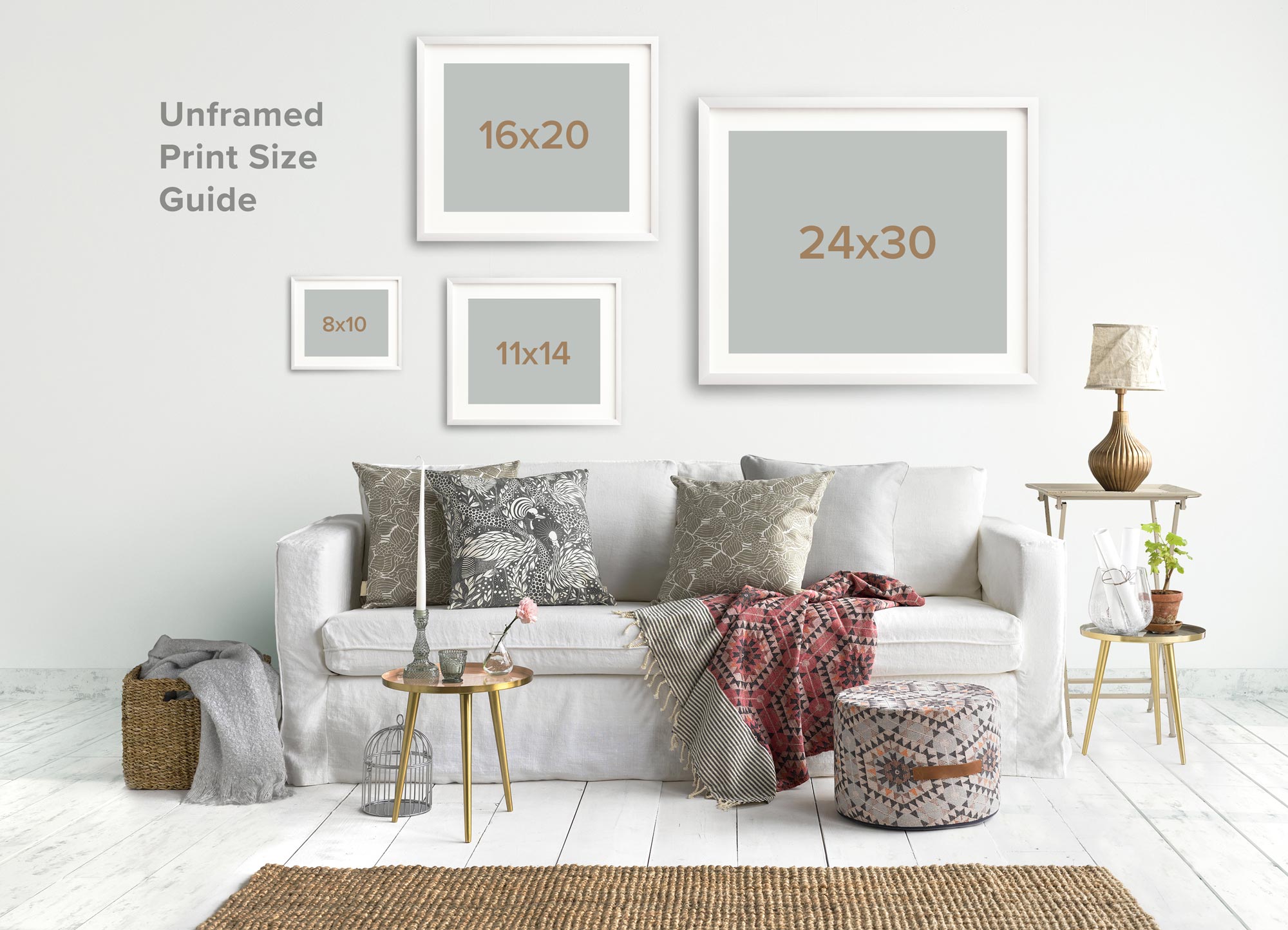 A cozy living room scene featuring a white sofa adorned with pillows, an Offley Green &#39;Santa Monica Pier&#39; print on archival photographic paper, and a size guide for the frames. There&#39;s a lamp, side tables.