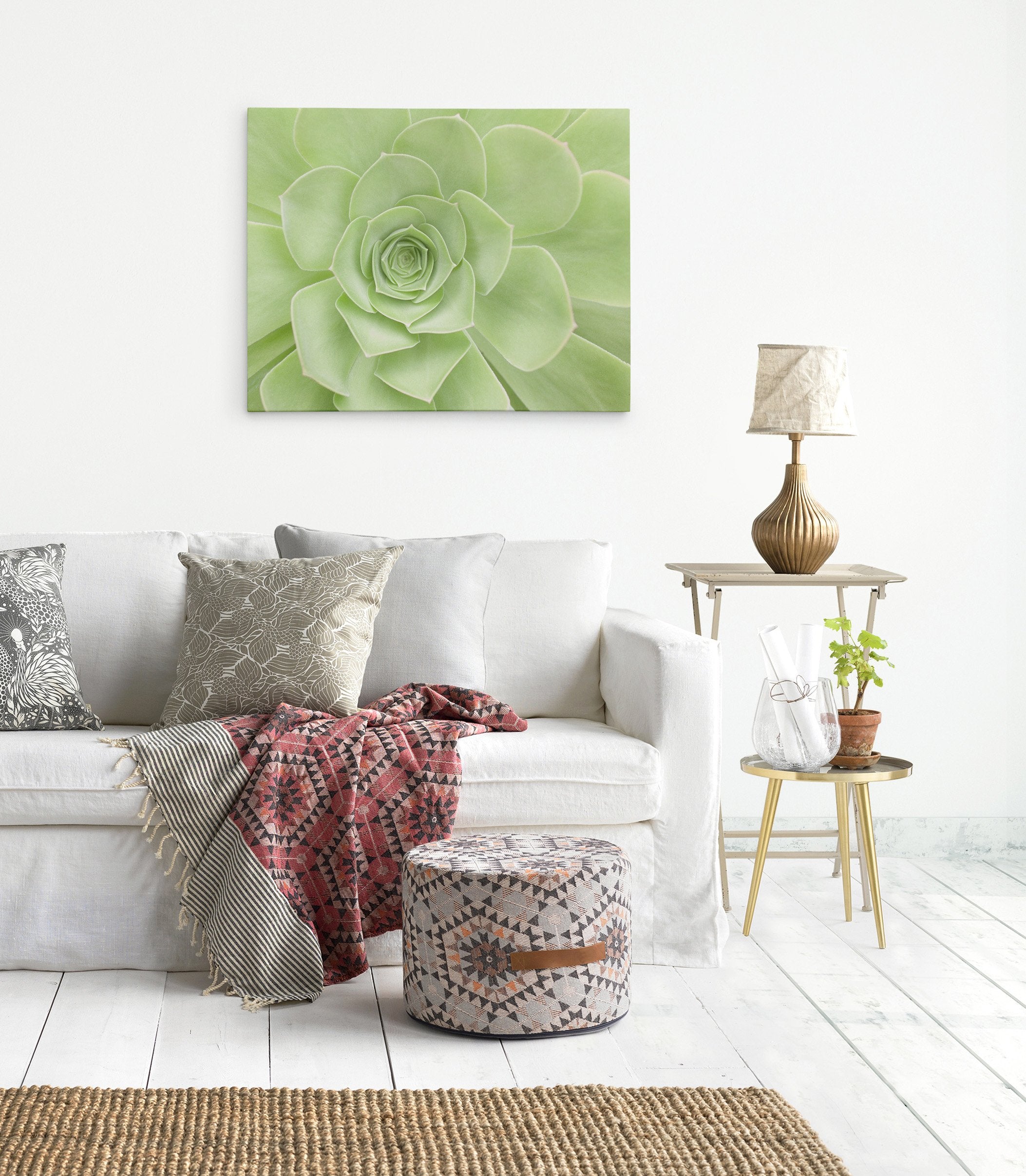 Green canvas wall art in a living room featuring a succulent plant