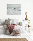Living room wall art featuring a coastal scene on canvas of waves breaking over rocks