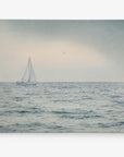 Canvas Print of a Sailing Boat against a Gray Sky